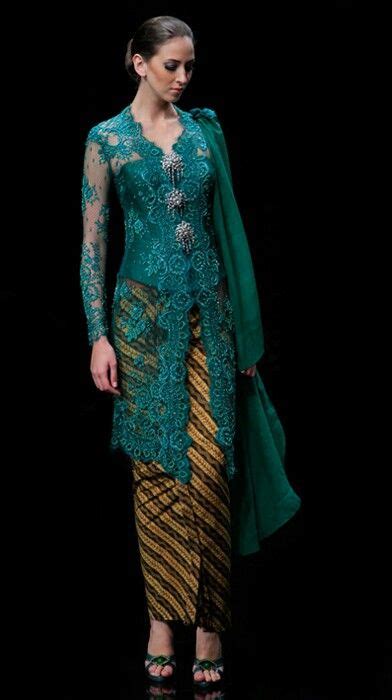 A traditional blouse-dress combination that originates from Indonesia ...