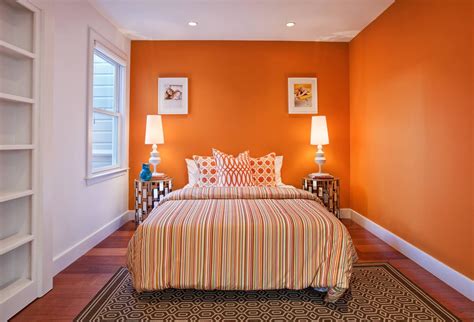 Charming bedroom ideas with striped orange quilt and rounded orange ...