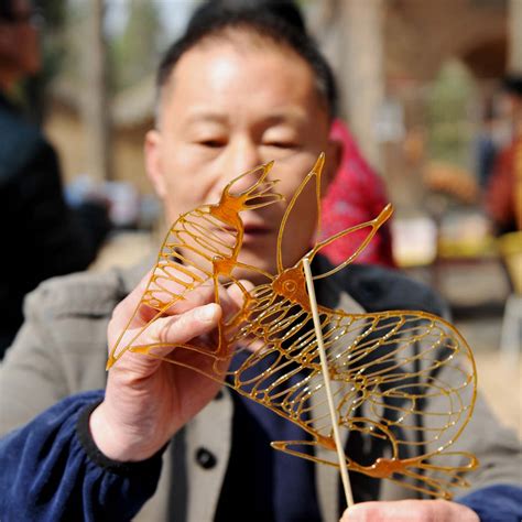 Folk artist creates sugar paintings[1]- Chinadaily.com.cn