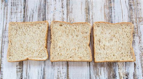 Whole wheat bread on white wooden background 6426095 Stock Photo at ...