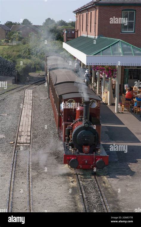 A train waits at Tywyn Wharf Station at the The Talyllyn Railway ...