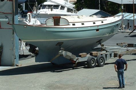 a man standing in front of a boat being unloaded