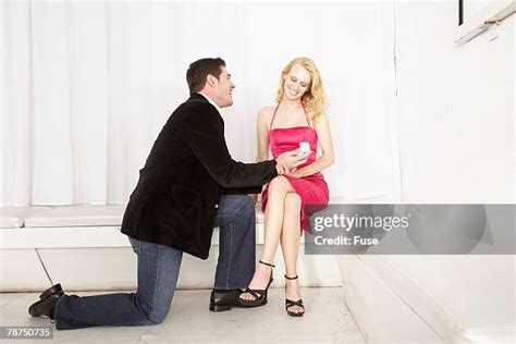 Man Kneeling Proposing Photos and Premium High Res Pictures - Getty Images