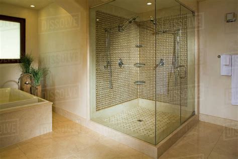 Modern seamless glass shower with double shower heads - Stock Photo ...