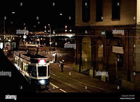 Zurich by night as a tram rushes by Stock Photo - Alamy