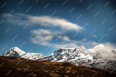 Premium Photo | High mountains under blue dark night sky with stars ...