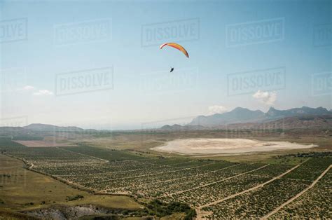 person flying on paraglider sky with clouds on background - Stock Photo ...