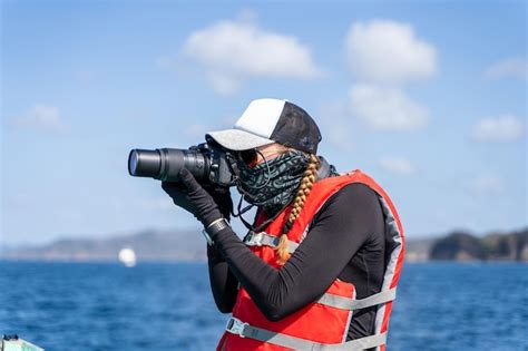 Premium Photo | Equipped marine biologist taking photos on the sea