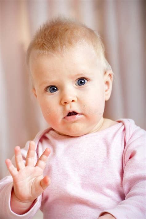 Cute Baby Girl Waving Hello/goodbye Stock Image - Image: 27722591