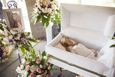 Liana Kotsura in her open casket during her funeral. Casket, Funeral ...