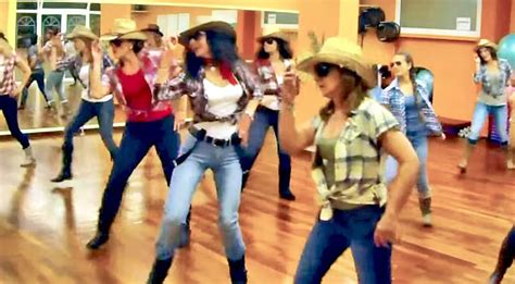 Cowgirls Kick Up Their Heels In Boot-Stompin' Brooks & Dunn Line Dance