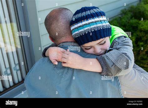 Father and son hugging Stock Photo - Alamy