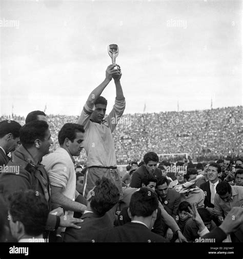 17 JUNE 1962 BRAZIL'S CAPTAIN, MAURO RAMOS, HOLDS ALOFT THE JULES RIMET ...