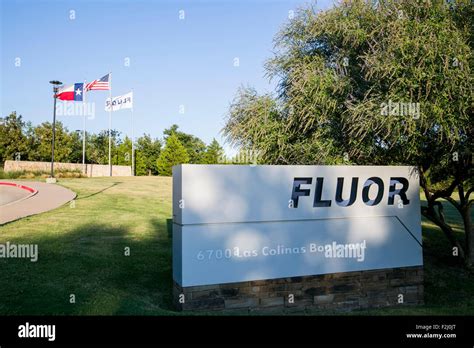 A logo sign outside of the headquarters of the Fluor Corporation in ...