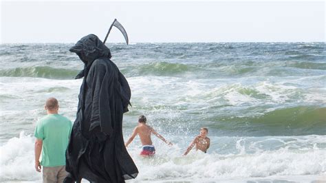 Coronavirus Florida: Grim reaper brings his protest to Pensacola Beach