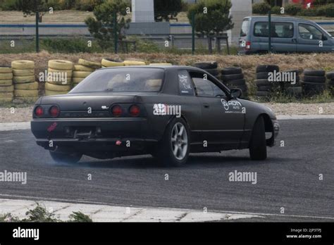 The Nissan Skyline GT-R drifting on a race track Stock Photo - Alamy