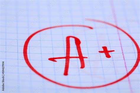 Grade A+ written on an exam paper Stock Photo | Adobe Stock