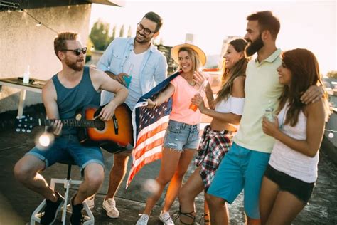 Group of happy friends having party and fun on rooftop - Stock Image ...