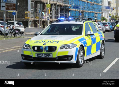 A MARKED BMW POLICE CAR OF SUSSEX POLICE TRAFFIC DIVISION IEITH BLUE ...