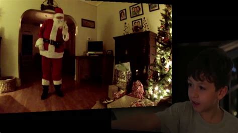 Boy catches Santa Claus delivering presents on video - ABC13 Houston