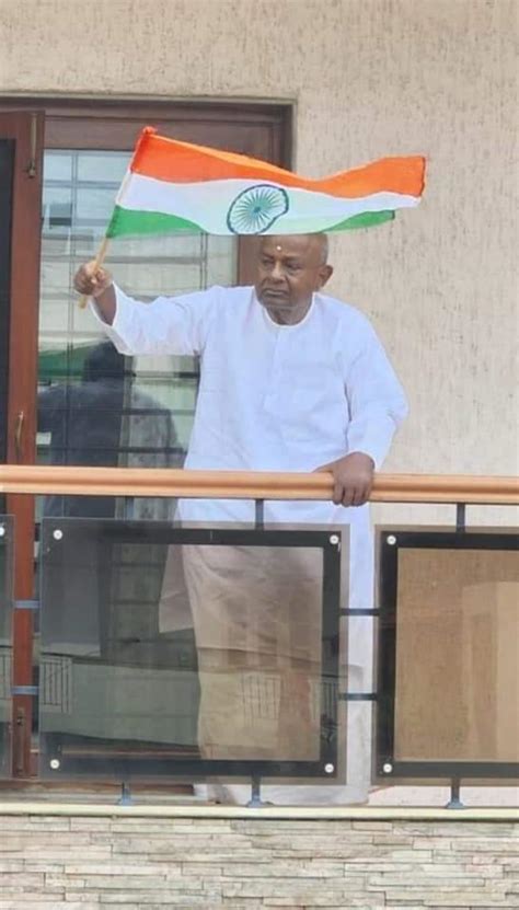 JDS supremo H D Deve Gowda waves national flag from balcony of his ...