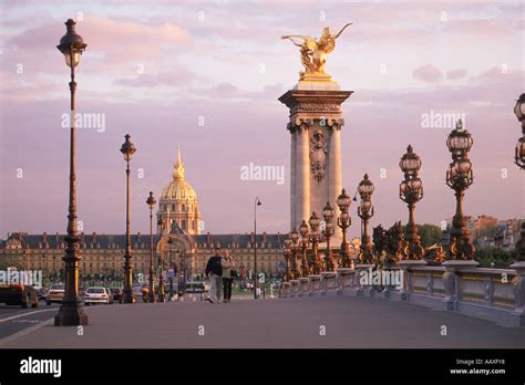 Pont Alexandre III and Hotel des Invalides at sunset in Paris Stock ...