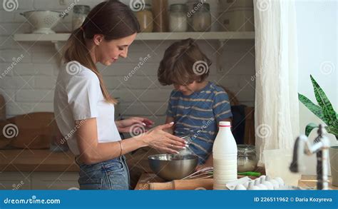 Family Cooking in Kitchen. Mother Son Cook Together Boy Looks at Sieve ...