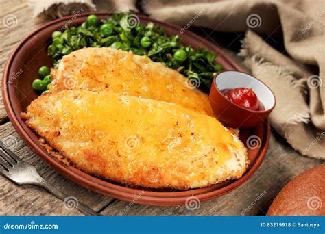 Chicken Cheese Schnitzel with Green Salad and Tomato Sauce Stock Photo ...