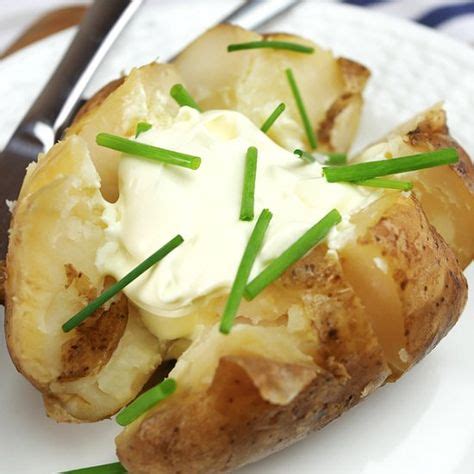 Jacket potatoes topped with sour cream and chives. (With images) | Slow ...