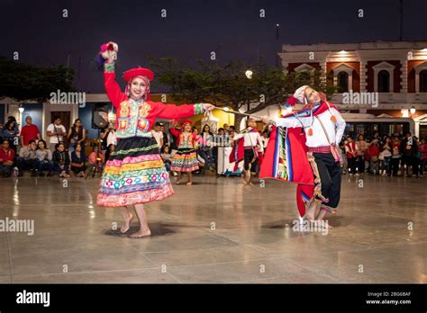 Dancers in colourful costumes performing traditional Huayno Cusqueño ...