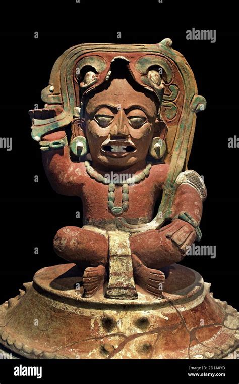 Funerary urn with depiction of the solar god Kinich Ahau and the image ...