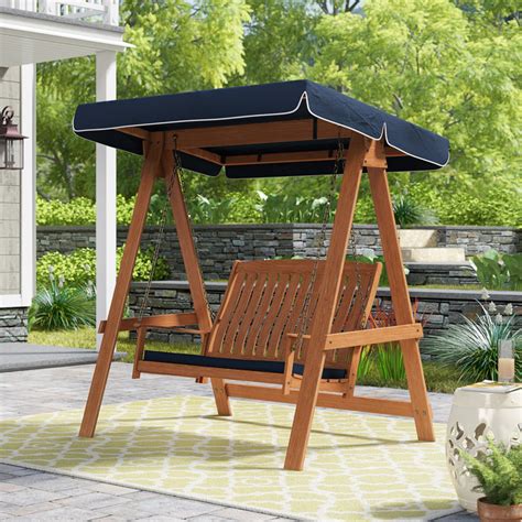 Darby Home Co Peggy 2 Person Solid Wood Porch Swing with Canopy ...