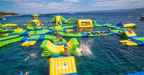 Jump on these floating water parks across Michigan