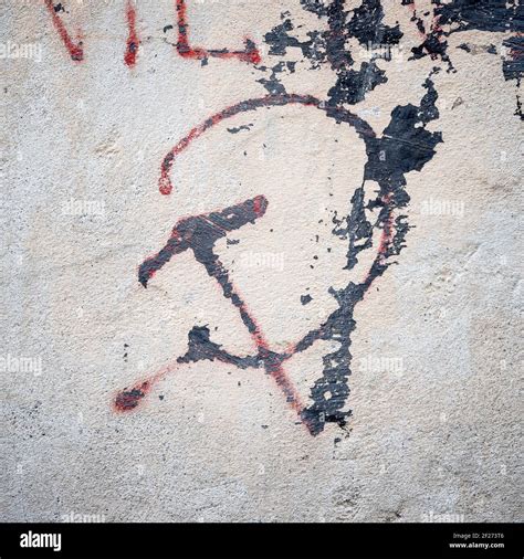 Communistic symbol: Grungy hammer and sickle graffiti on and old wall ...