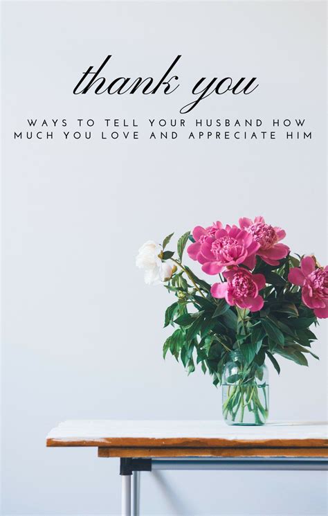 a vase filled with pink flowers sitting on top of a wooden table next ...