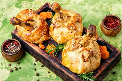 Chicken Legs In Pastrychicken Leg In Puff Pastry On Cutting Board ...