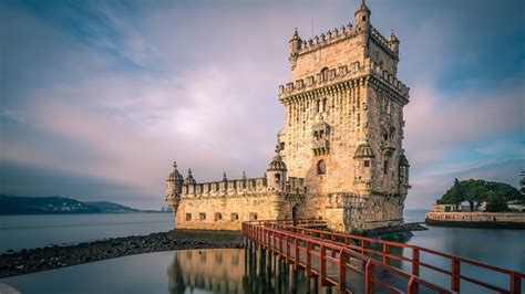 Belém Tower (Torre de Belém) at the Tagus river in Lisbon at sunrise ...