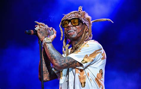 Lil Wayne fans injured fleeing concert after 'gunshots' are heard