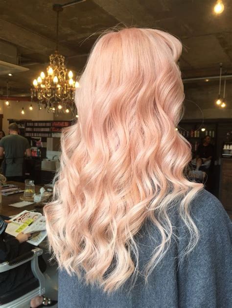 Soft pastel peach hair colour with gentle curls at Live True London ...