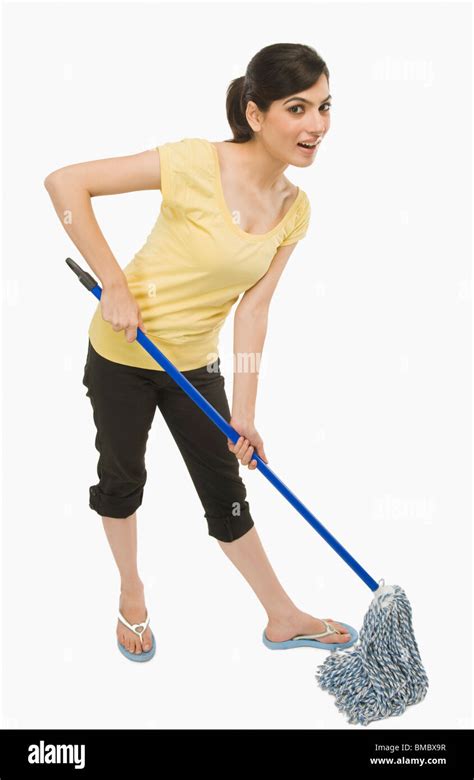 Woman cleaning floor with a mop Stock Photo - Alamy