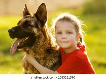 Child Dog Hugging Outdoors Stock Photo 1083231590 | Shutterstock