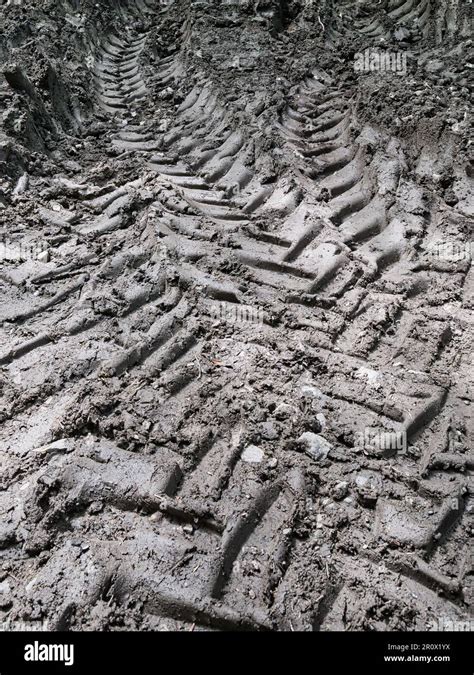 Tractor tire tracks in mud as texture or background Stock Photo - Alamy