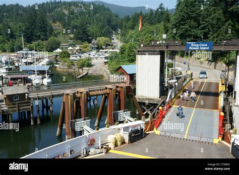 People boarding the ferry in Snug Cove, Bowen Island, British Columbia ...