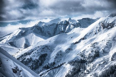 Snow Covered Mountain Peaks In Colorado Photograph by Rob Hammer