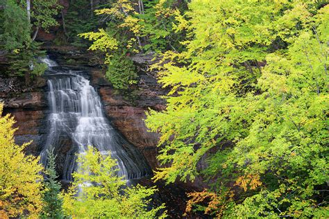 Chapel Falls among the autumn changing colors of the Hiawatha National ...