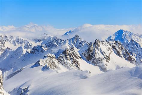 Mountain Ranges Covered in Snow · Free Stock Photo