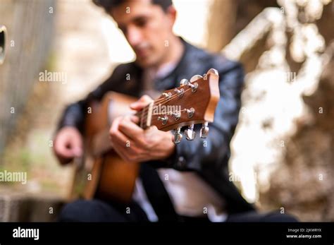 Fire Detail of a Boy Playing Guitar in an Alley Stock Photo - Alamy