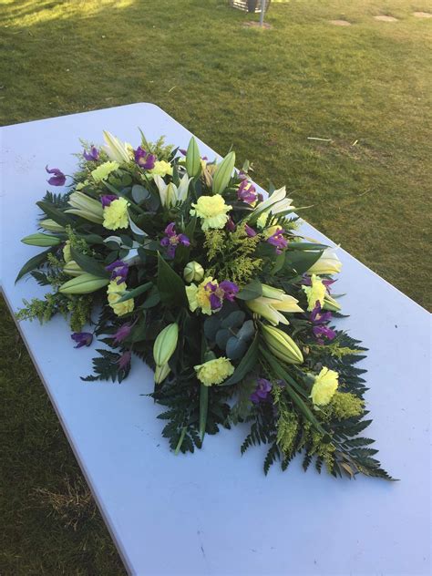 Casket double ended funeral spray, white, purple and yellow. Lilies ...