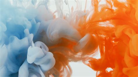 Liquid Reaction in Mixing Orange and Blue Paints · Free Stock Photo