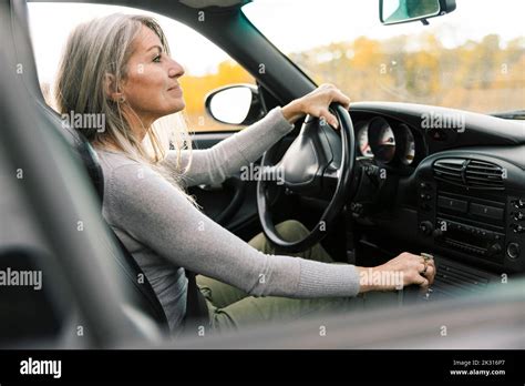 Woman driving sports car Stock Photo - Alamy